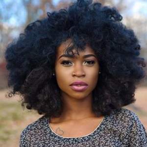 girl with a big afro and a heart tattoo girl with a big afro and a heart tattoo